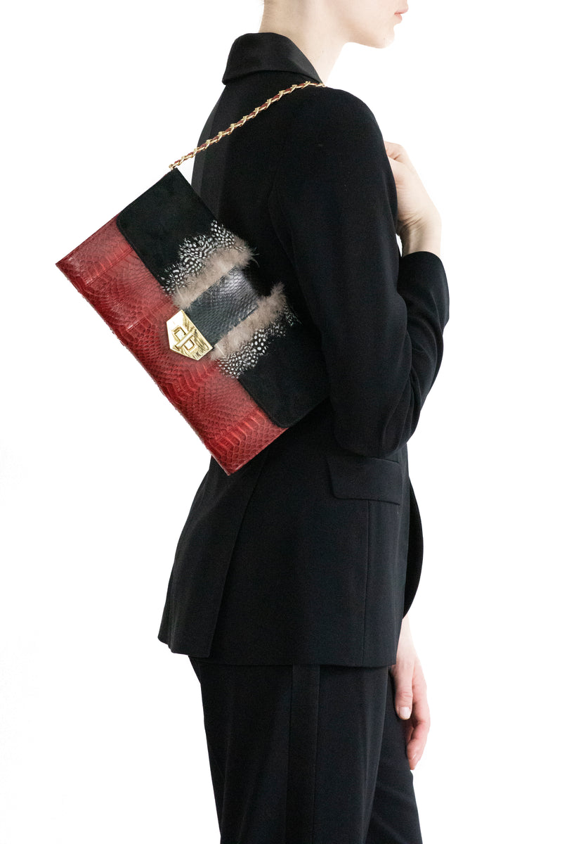 COCOTTE clutch red and black with a shoulder strap