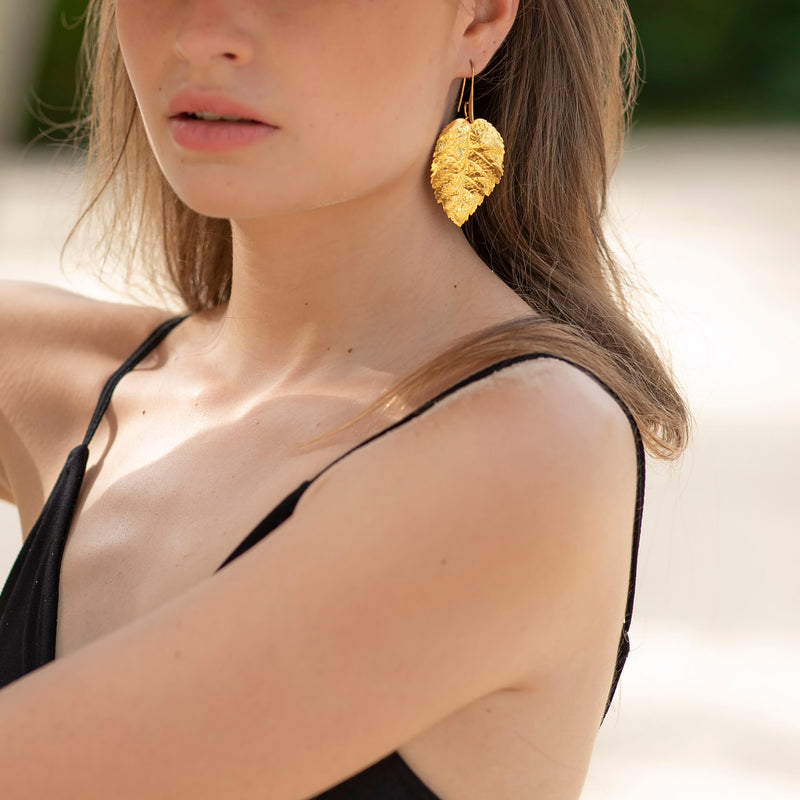 SERAPHINE gold metal leaves earrings